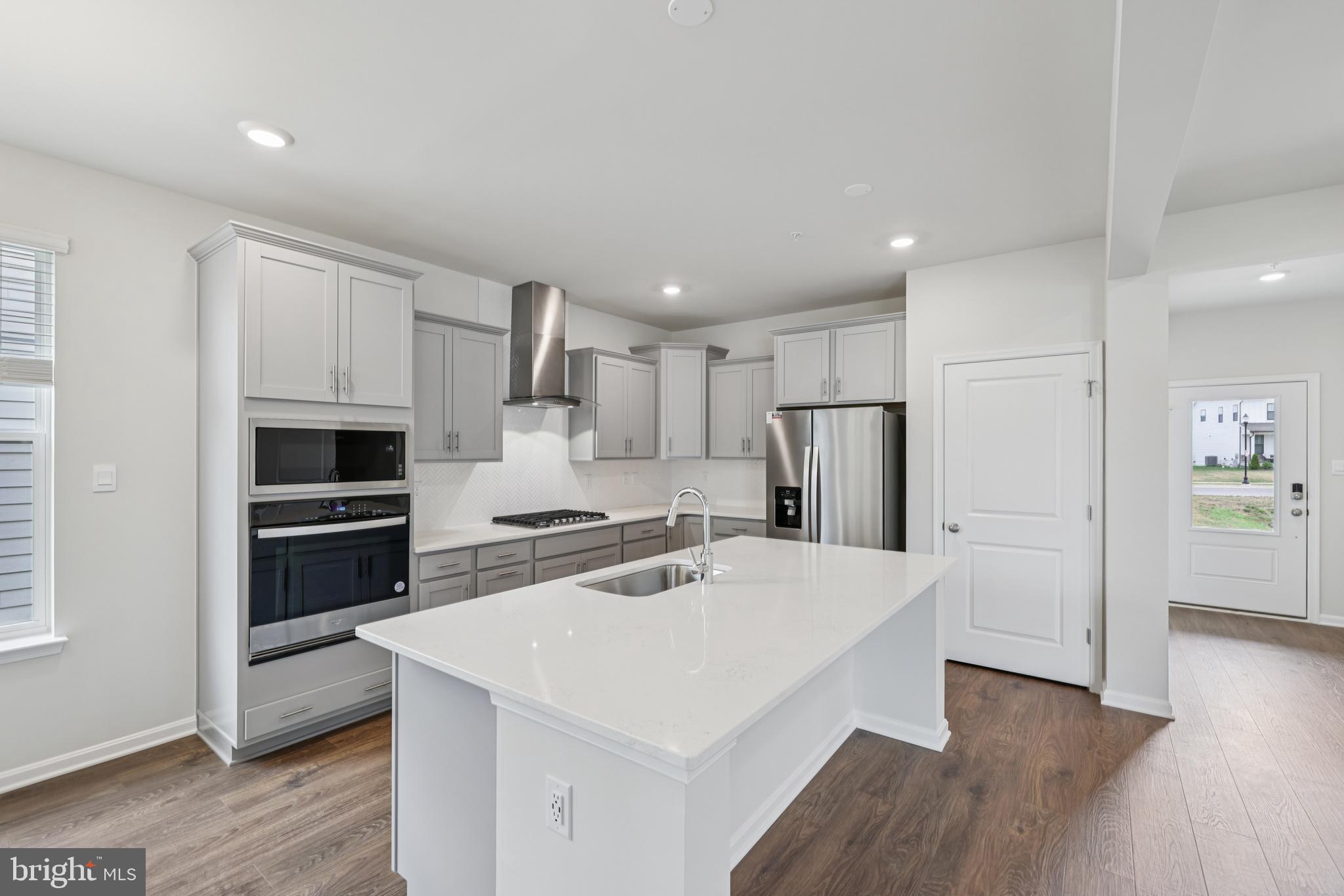 470 Herringbone Way Frederick, MD 21701 - Photo 18 of 61 a kitchen with a white stove top oven and refrigerator