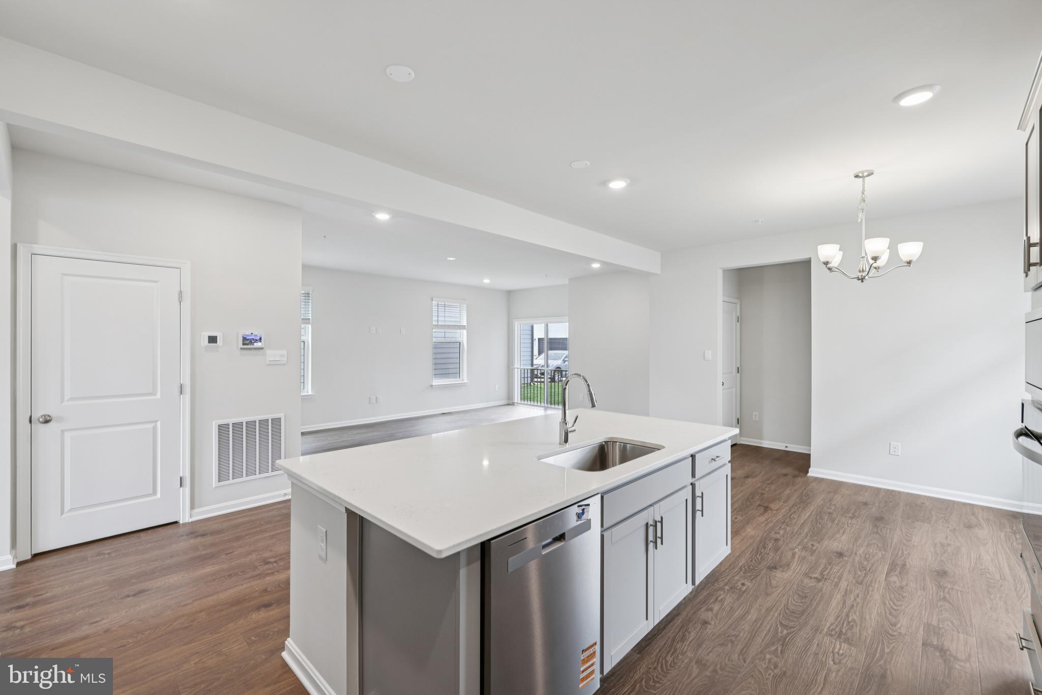 470 Herringbone Way Frederick, MD 21701 - Photo 20 of 61 a kitchen with a sink cabinets and wooden floor