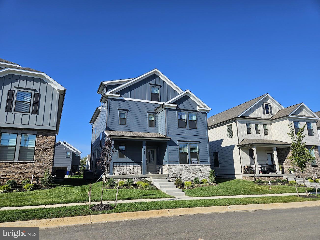 470 Herringbone Way Frederick, MD 21701 - Photo 2 of 61 a front view of a house with a yard