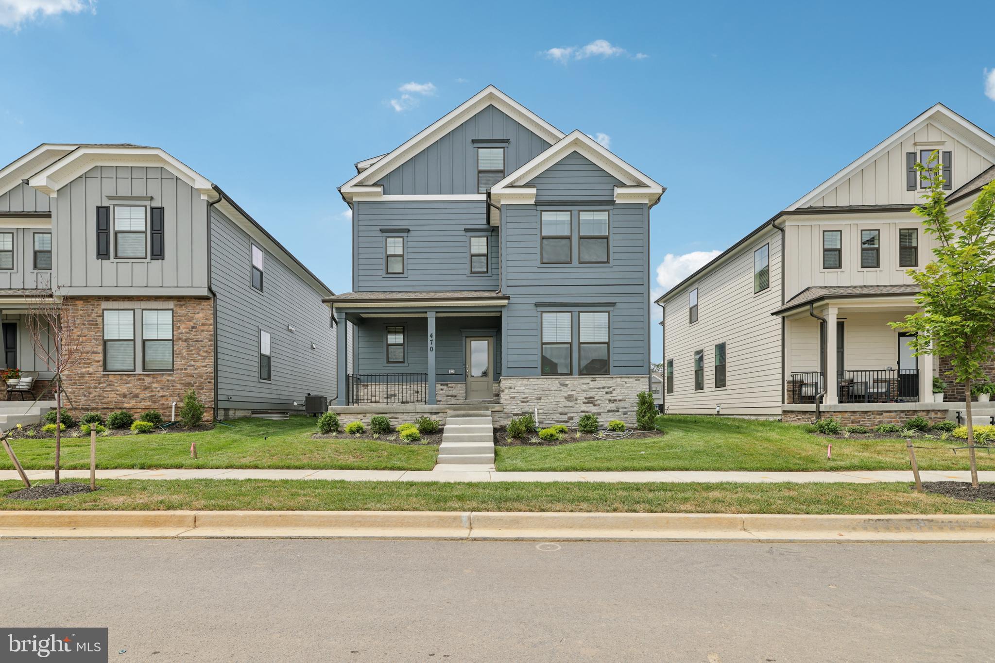 470 Herringbone Way Frederick, MD 21701 - Photo 3 of 61 a front view of a house with a yard