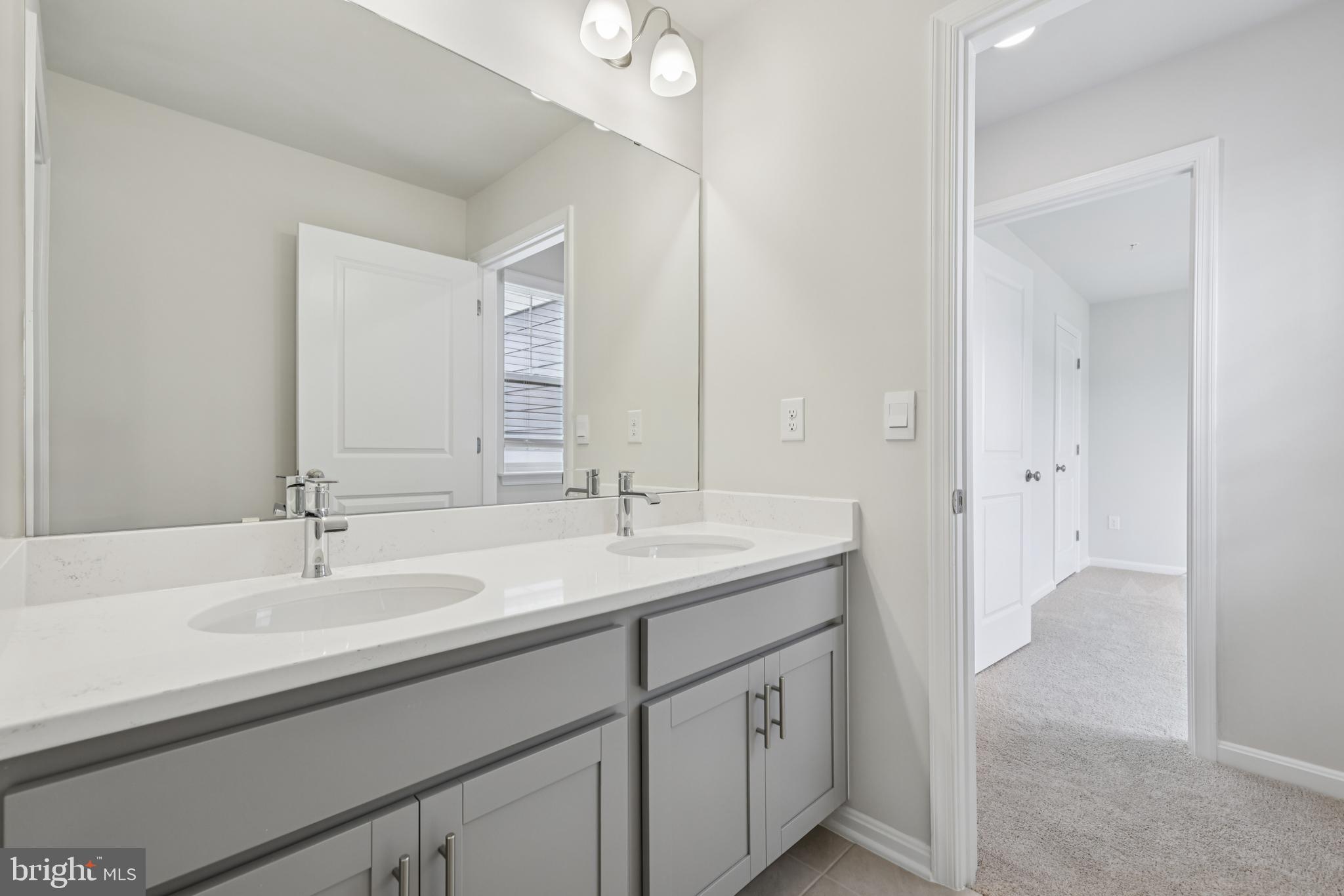470 Herringbone Way Frederick, MD 21701 - Photo 38 of 61 a bathroom with a sink and a mirror