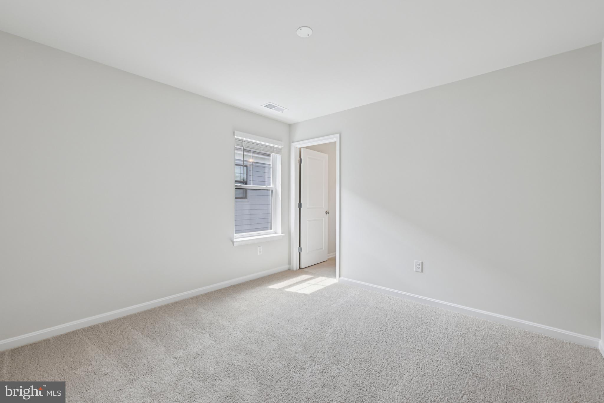 470 Herringbone Way Frederick, MD 21701 - Photo 43 of 61 a view of an empty room with a window