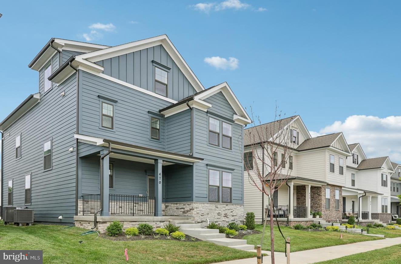 470 Herringbone Way Frederick, MD 21701 - Photo 5 of 61 a front view of a house with a yard