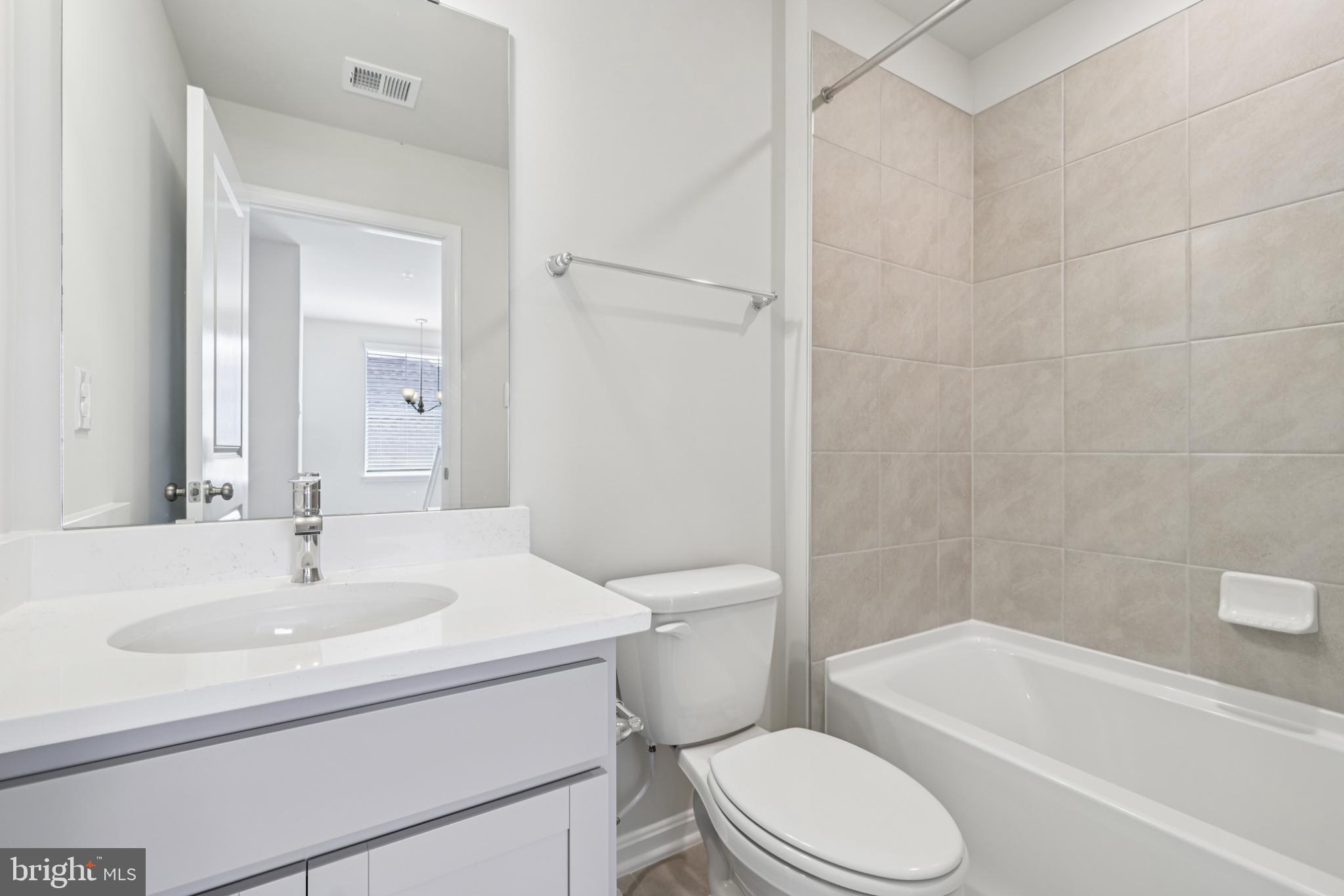 470 Herringbone Way Frederick, MD 21701 - Photo 57 of 61 a bathroom with a sink toilet and shower