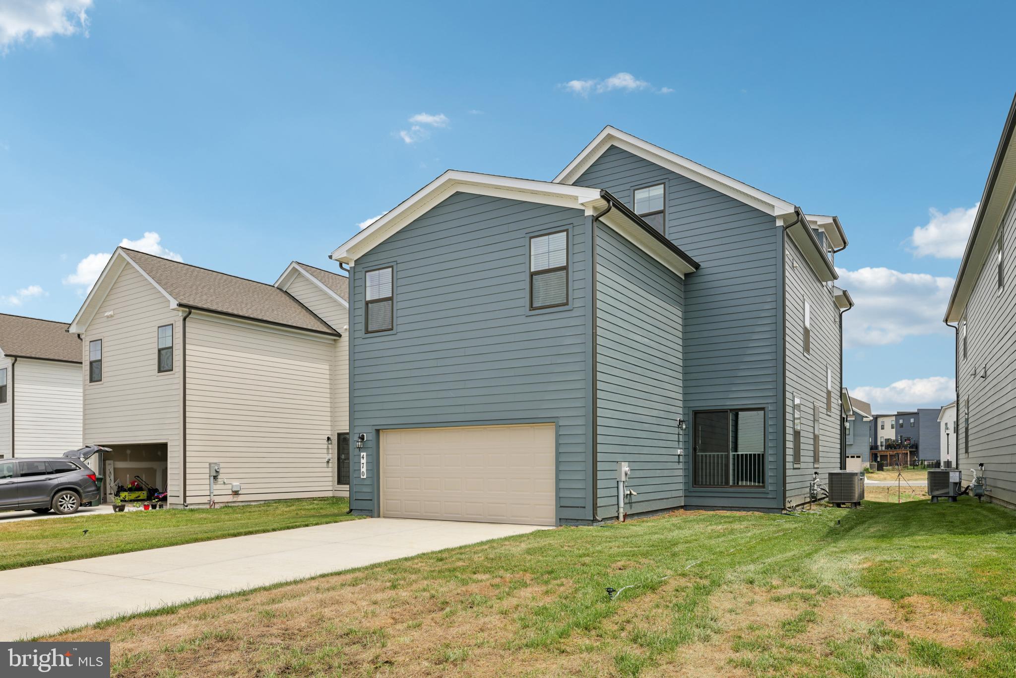 470 Herringbone Way Frederick, MD 21701 - Photo 60 of 61 a front view of a house with a yard and garage
