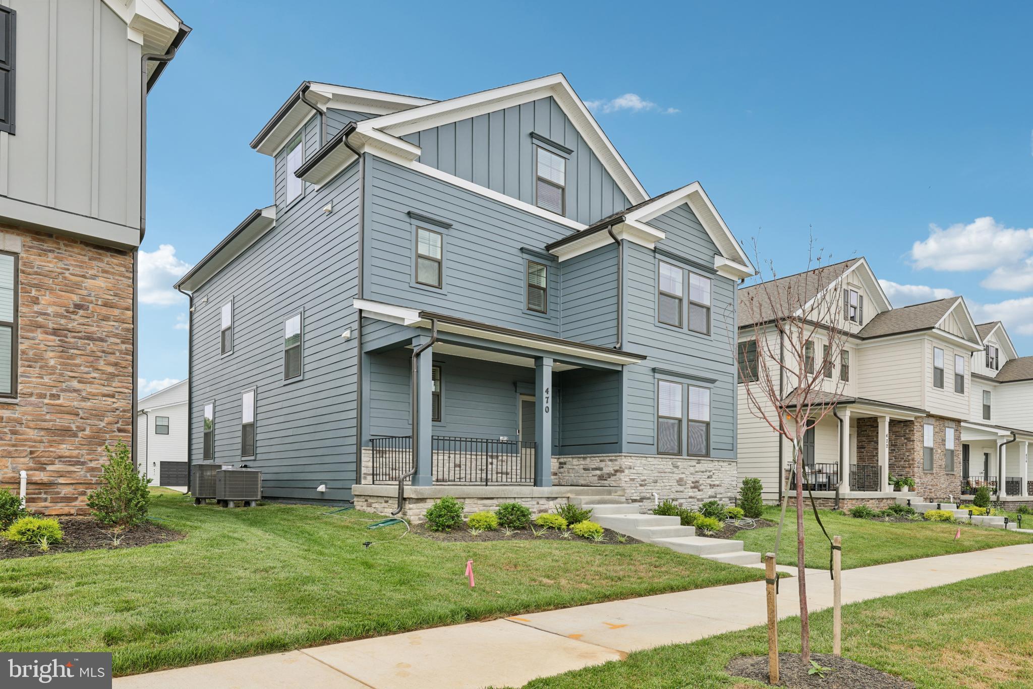 470 Herringbone Way Frederick, MD 21701 - Photo 6 of 61 a front view of a house with a yard
