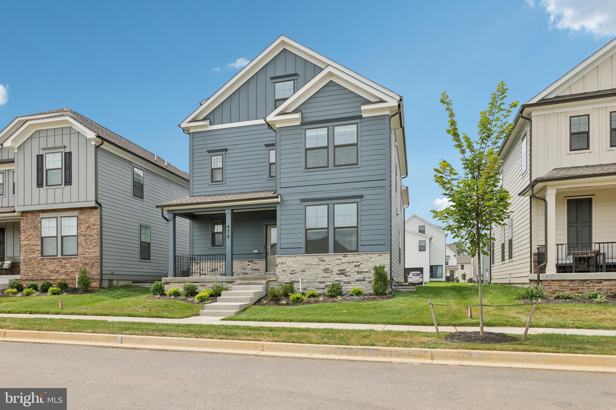470 Herringbone Way Frederick, MD 21701 - Photo 8 of 61 a front view of a house with a yard