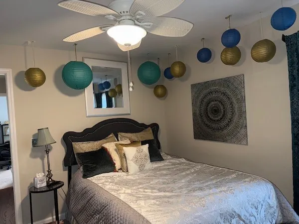 a bedroom with a bed and painted walls