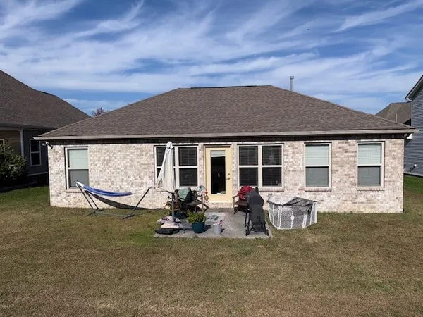 front view of house with outdoor seating