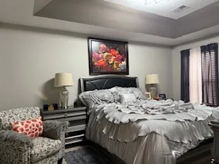 a bedroom with a bed and dresser