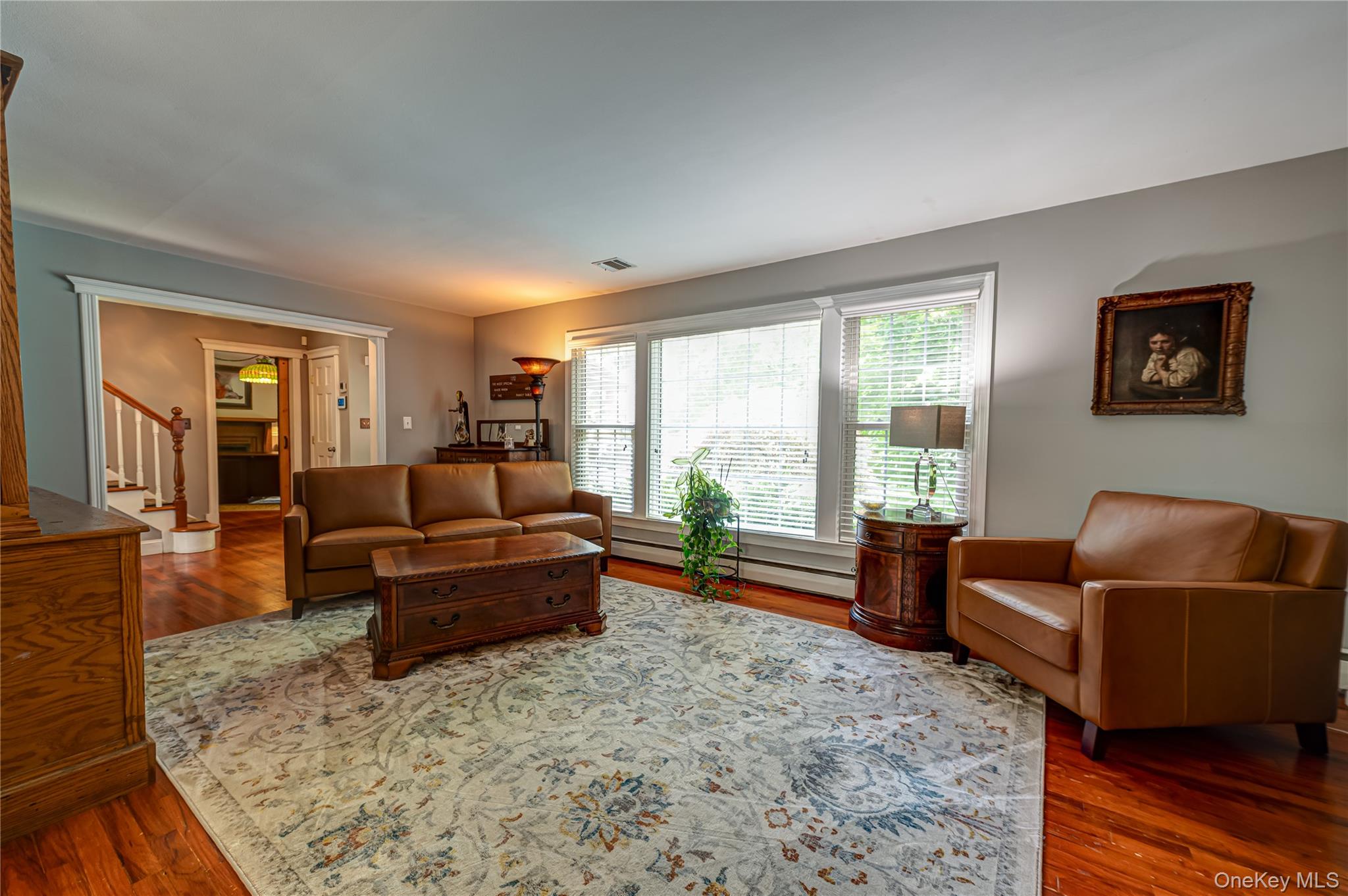 3 Thompson Hill Road St. James, NY 11780 - Photo 6 of 34 a living room with furniture and a large window