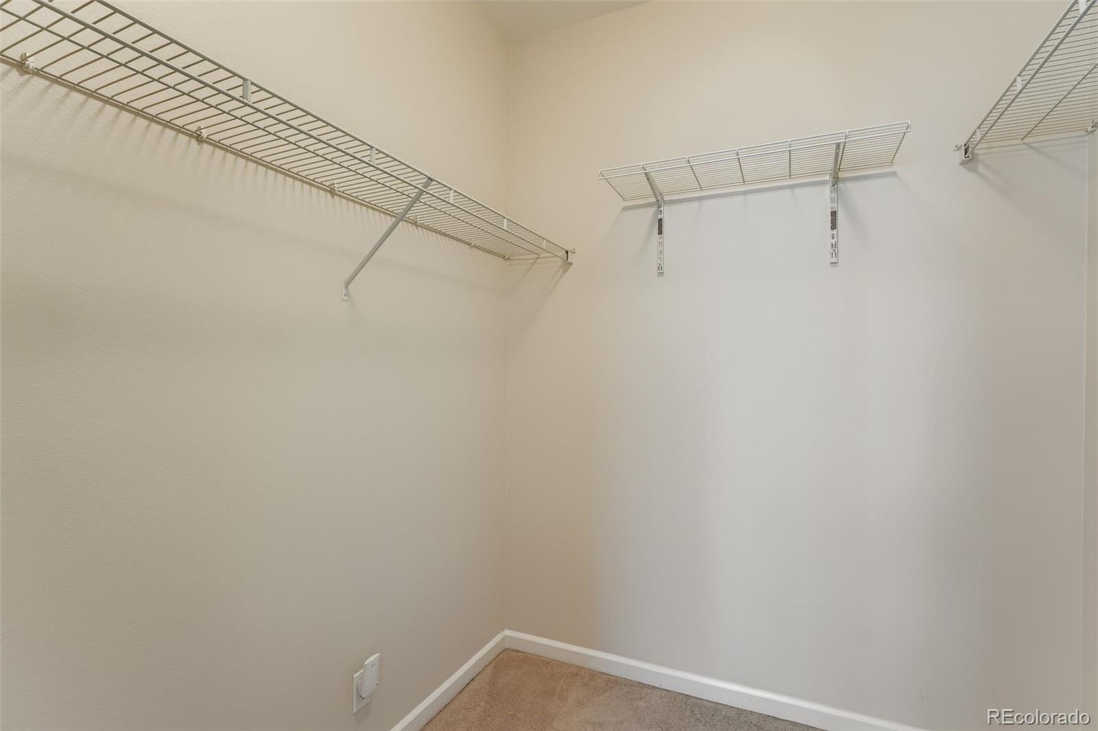 2680 Blake Street, Unit 18 Denver, CO 80205 - Photo 16 of 29 a view of a room with racks on the wall