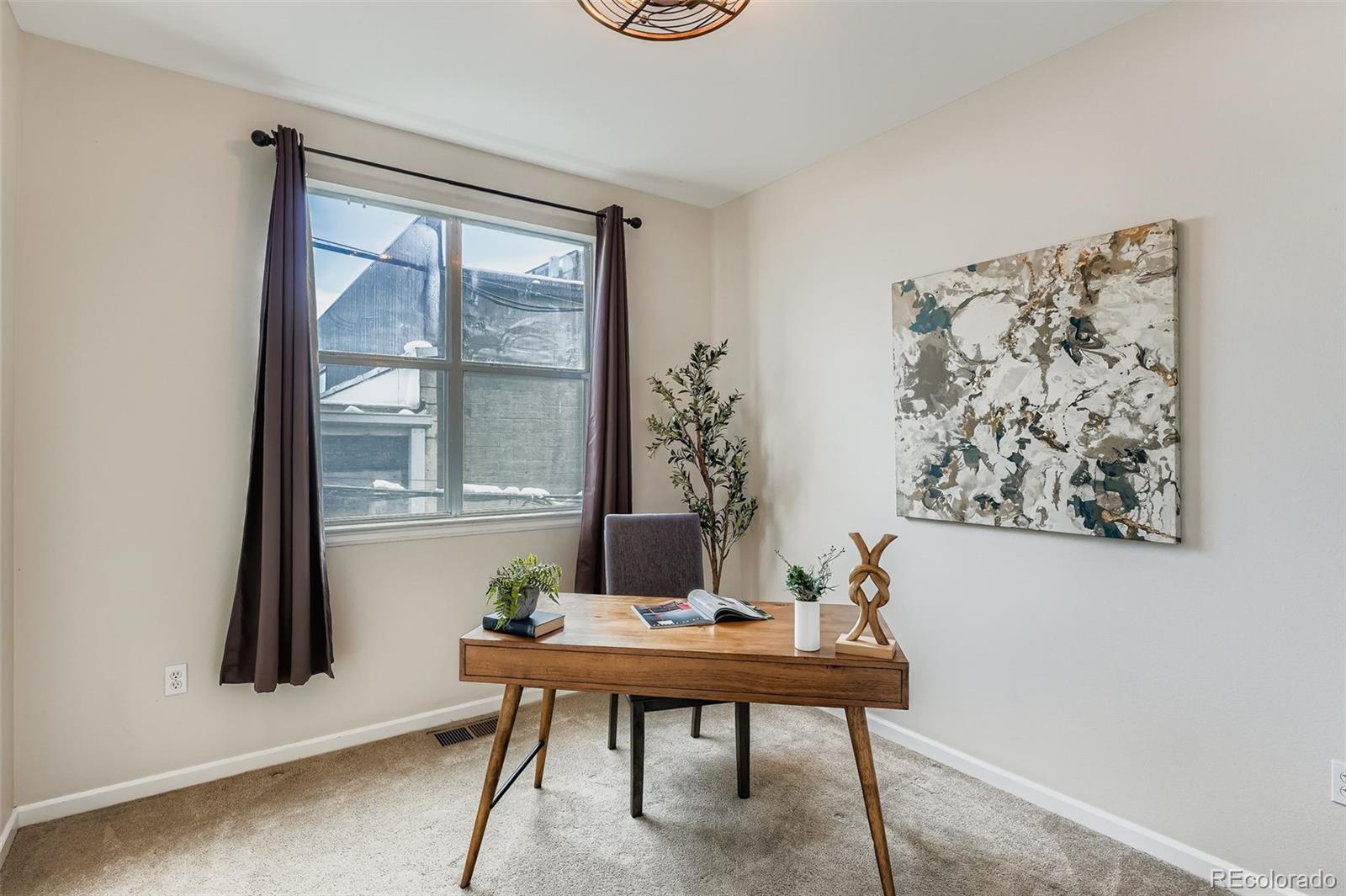 2680 Blake Street, Unit 18 Denver, CO 80205 - Photo 19 of 29 a living room with furniture and a window