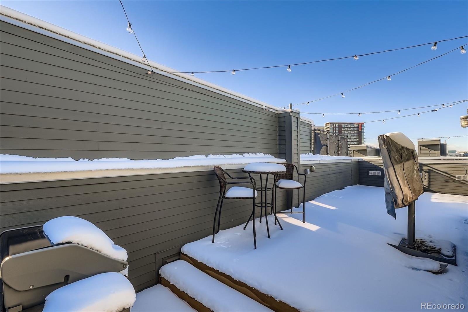 2680 Blake Street, Unit 18 Denver, CO 80205 - Photo 21 of 29 a balcony with table and chairs