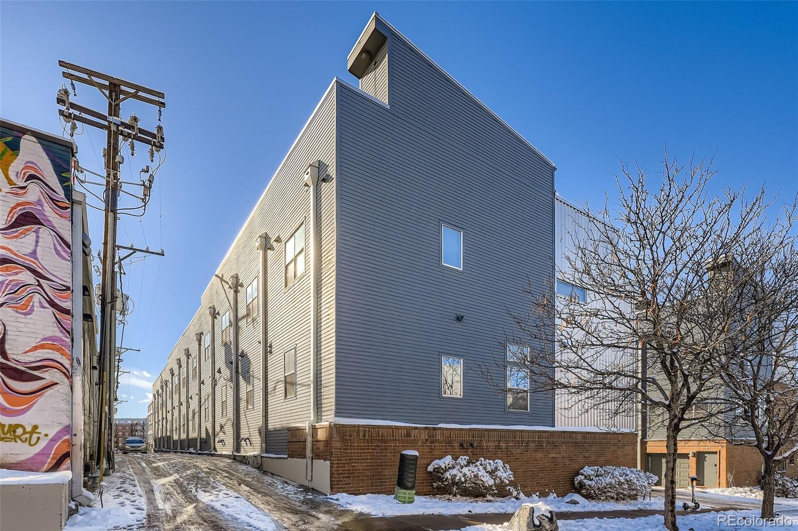 2680 Blake Street, Unit 18 Denver, CO 80205 - Photo 26 of 29 a front view of a house with a yard