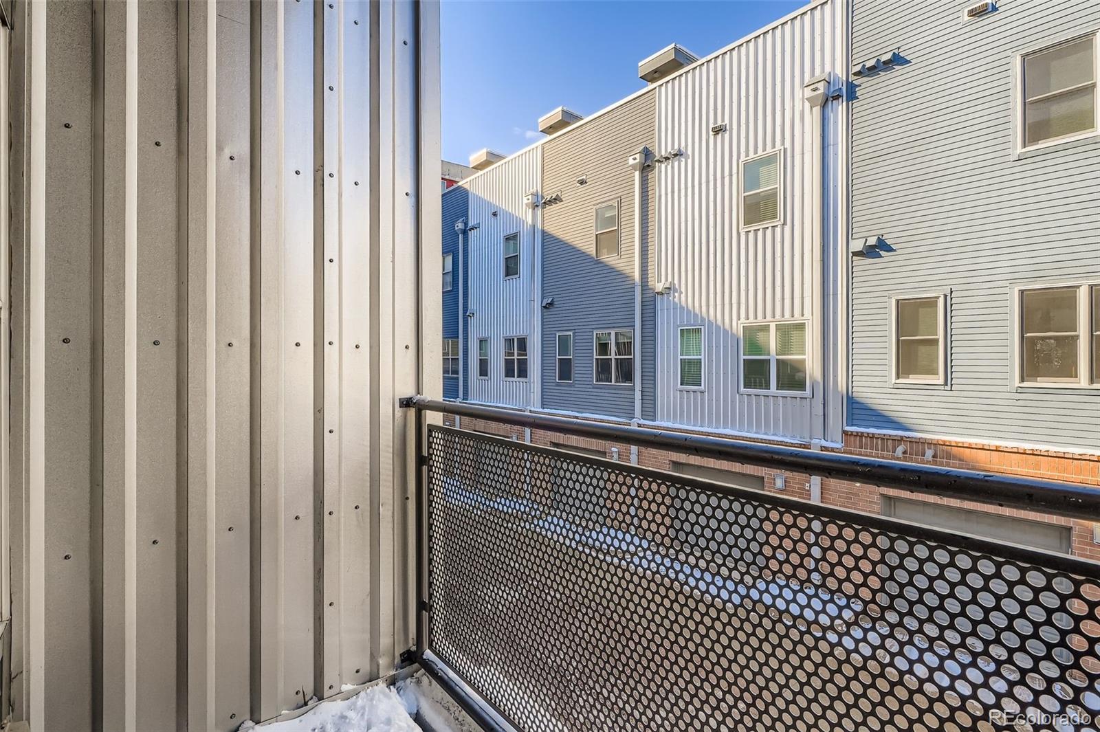2680 Blake Street, Unit 18 Denver, CO 80205 - Photo 6 of 29 a balcony view with a black gate