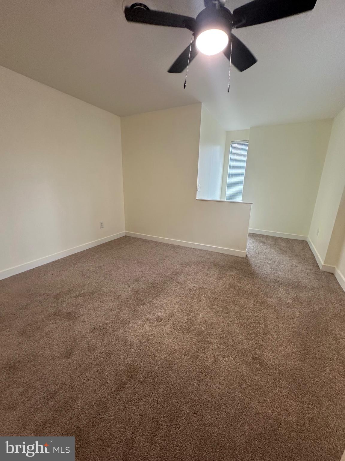 2300 South 12th Street, Unit 1 Philadelphia, PA 19148 - Photo 11 of 19 an empty room with a ceiling fan and a window