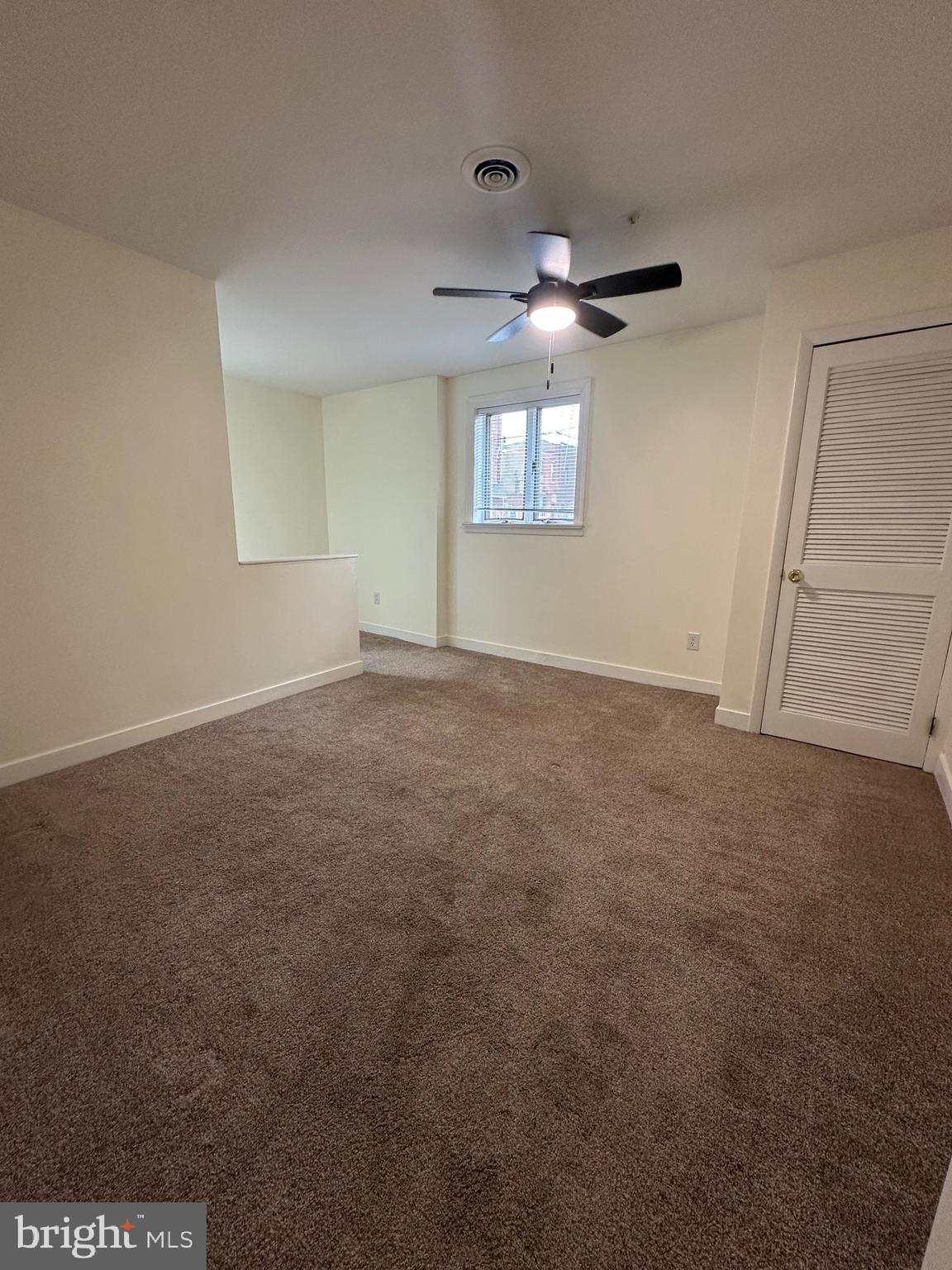 2300 South 12th Street, Unit 1 Philadelphia, PA 19148 - Photo 10 of 19 en empty room with windows and ceiling fan