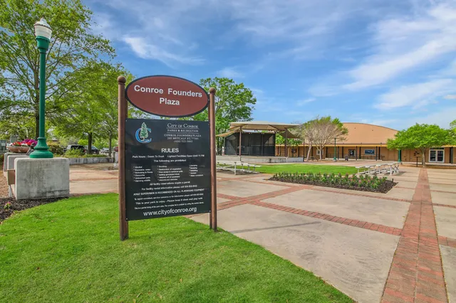 a utility room with dryer and tree