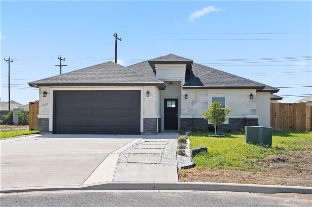 2112 North 28th Street Hidalgo, TX 78557 - Photo 1 of 22 a front view of a house with garden