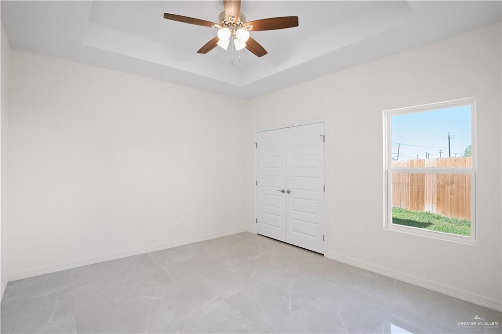 2112 North 28th Street Hidalgo, TX 78557 - Photo 14 of 22 an empty room with windows and closet