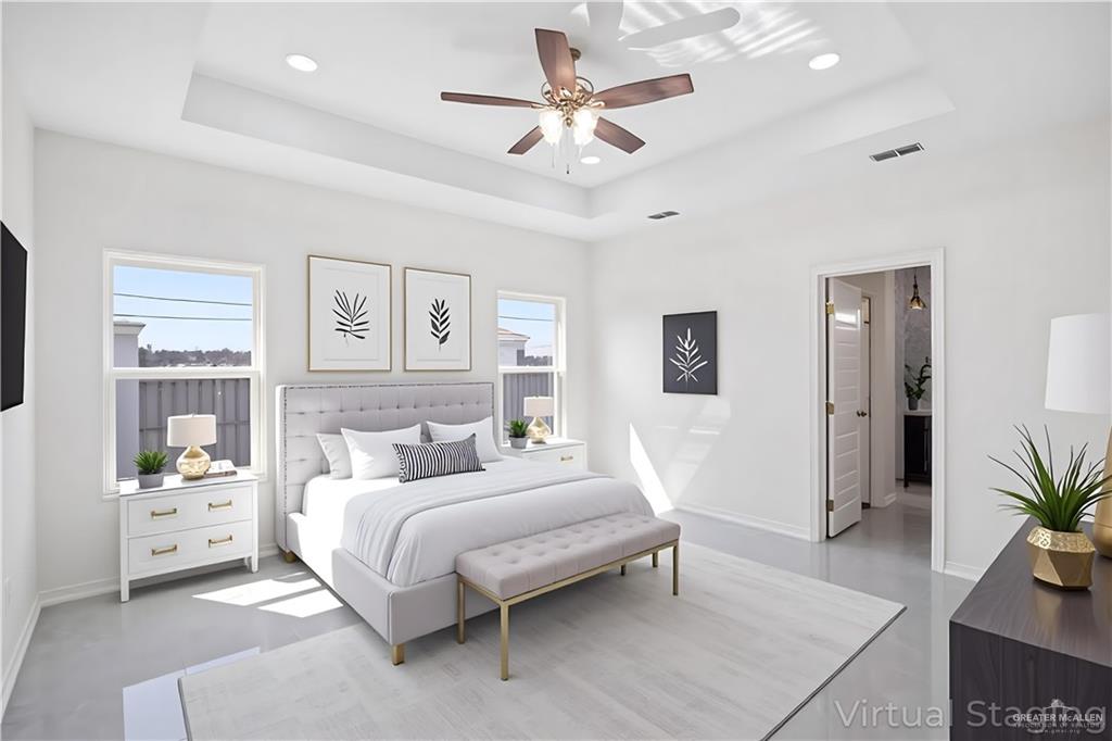 2112 North 28th Street Hidalgo, TX 78557 - Photo 10 of 22 a bedroom with a bed and glass windows