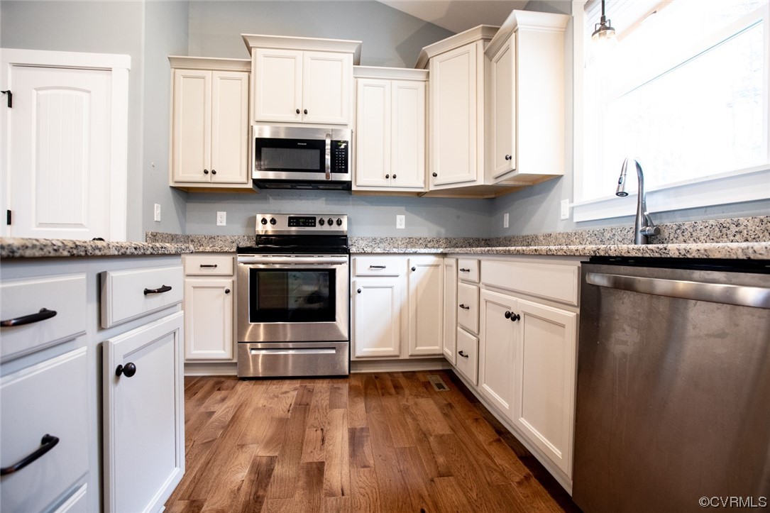 3659 Old Ridge Road Farmville, VA 23901 - Photo 12 of 44 a kitchen with granite countertop a stove top oven sink and cabinets