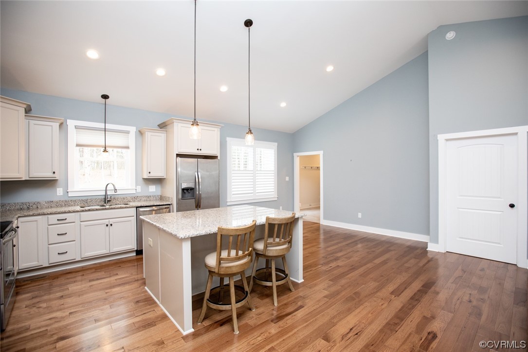 3659 Old Ridge Road Farmville, VA 23901 - Photo 15 of 44 a kitchen with stainless steel appliances granite countertop a kitchen island hardwood floor sink stove dining table and chairs