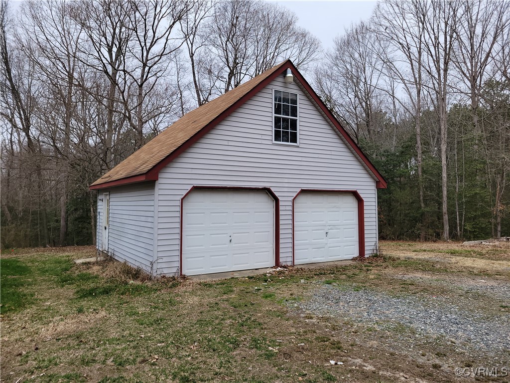 683 Oakes Landing Road Saluda, VA 23149 - Photo 27 of 29 Detached garage with a forest view