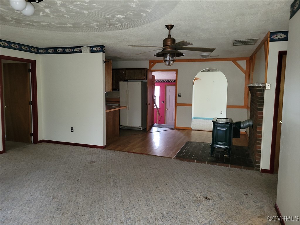 683 Oakes Landing Road Saluda, VA 23149 - Photo 4 of 29 Unfurnished living room with a textured ceiling, v