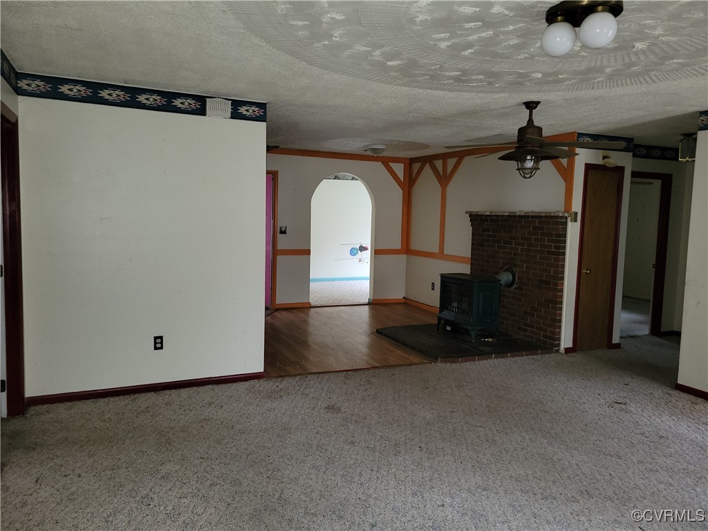 683 Oakes Landing Road Saluda, VA 23149 - Photo 5 of 29 Unfurnished living room featuring arched walkways,