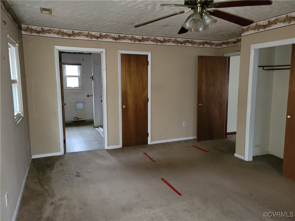 683 Oakes Landing Road Saluda, VA 23149 - Photo 8 of 29 Unfurnished bedroom with baseboards, carpet floori