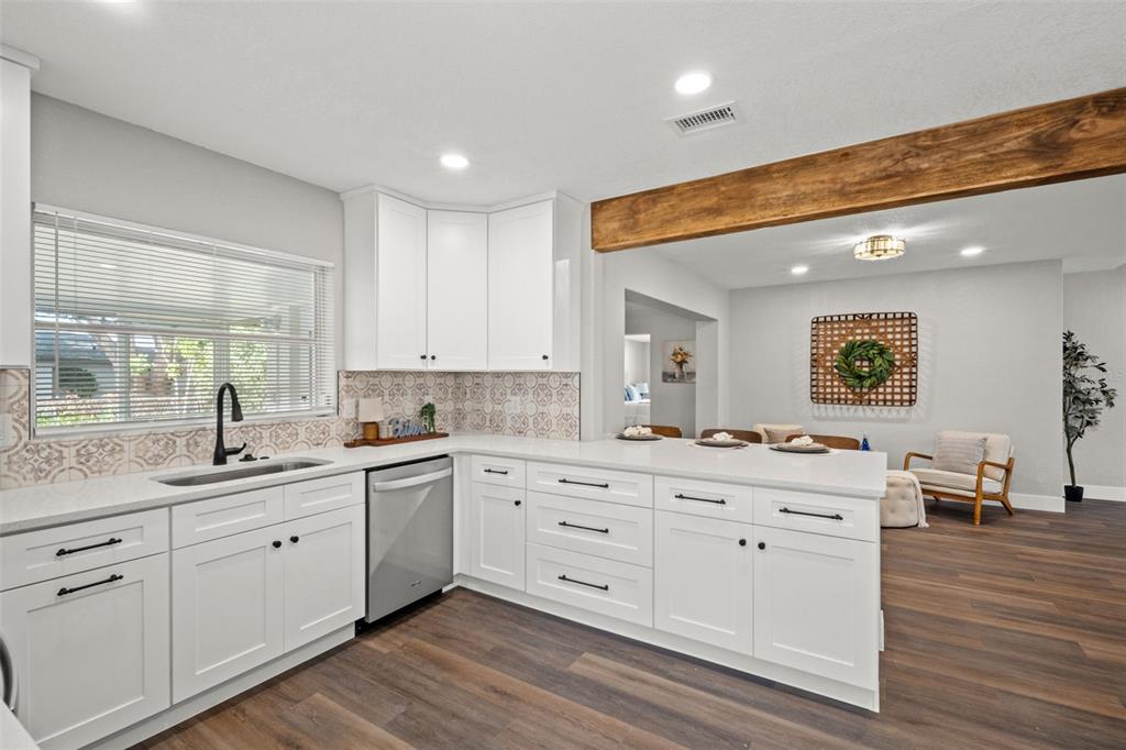 1472 Ruth Road Dunedin, FL 34698 - Photo 12 of 50 a large white kitchen with a large window
