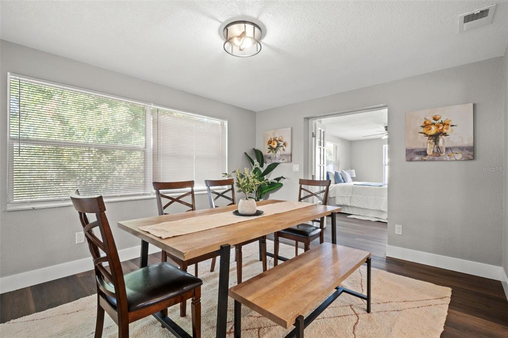 1472 Ruth Road Dunedin, FL 34698 - Photo 20 of 50 a view of a dining room with furniture window and wooden floor