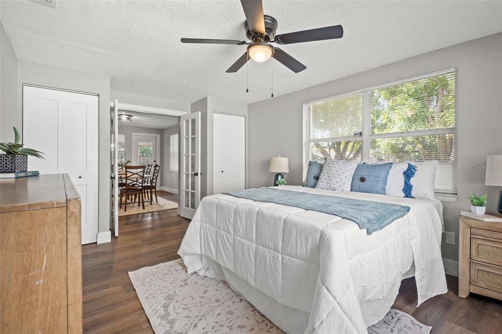 1472 Ruth Road Dunedin, FL 34698 - Photo 23 of 50 a bedroom with a bed and a chandelier