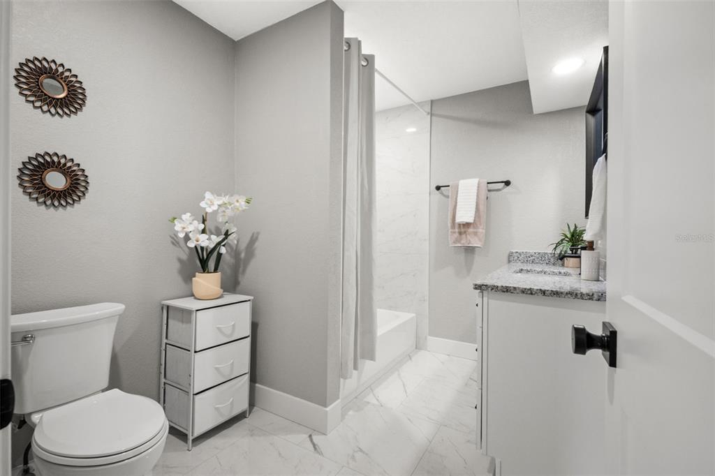 1472 Ruth Road Dunedin, FL 34698 - Photo 24 of 50 a bathroom with a toilet sink and shower