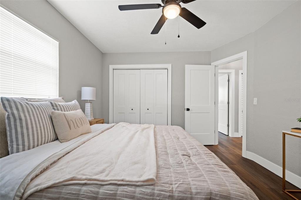 1472 Ruth Road Dunedin, FL 34698 - Photo 27 of 50 a bedroom with a large bed and a chandelier
