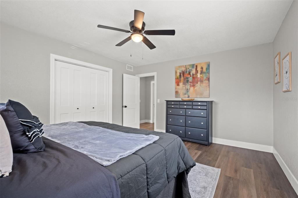 1472 Ruth Road Dunedin, FL 34698 - Photo 30 of 50 a bed room with a bed and a television