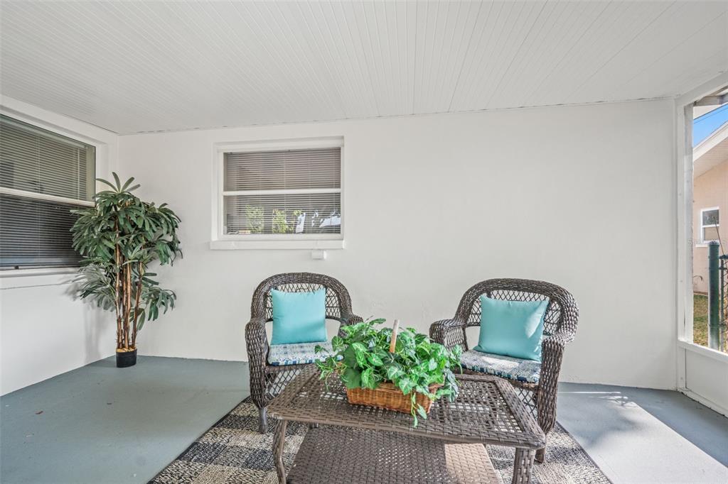 1472 Ruth Road Dunedin, FL 34698 - Photo 34 of 50 a front view of a house with garden and plants