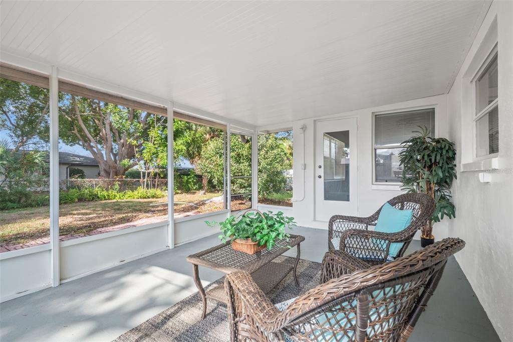 1472 Ruth Road Dunedin, FL 34698 - Photo 35 of 50 a dining room with furniture front door and wooden floor