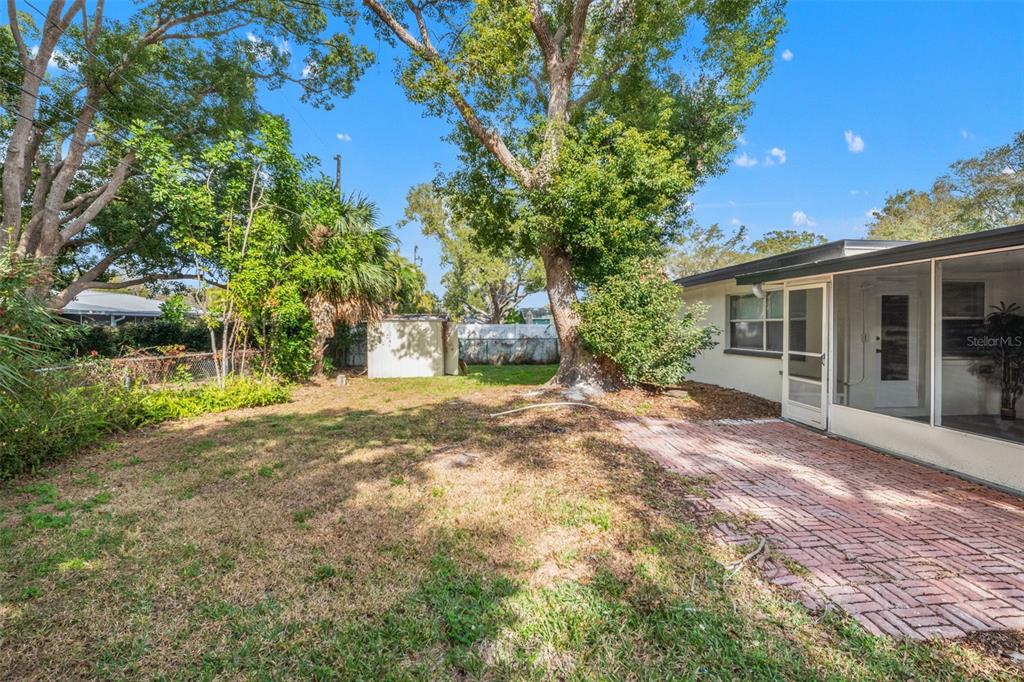 1472 Ruth Road Dunedin, FL 34698 - Photo 36 of 50 a view of a house with a yard