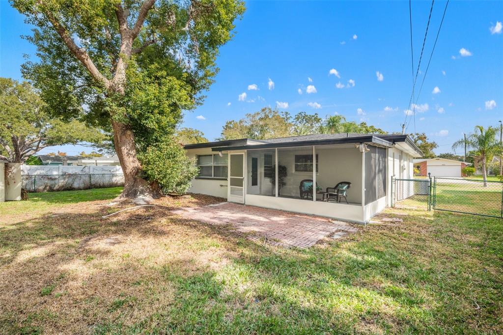 1472 Ruth Road Dunedin, FL 34698 - Photo 37 of 50 a view of a house with a yard and sitting area