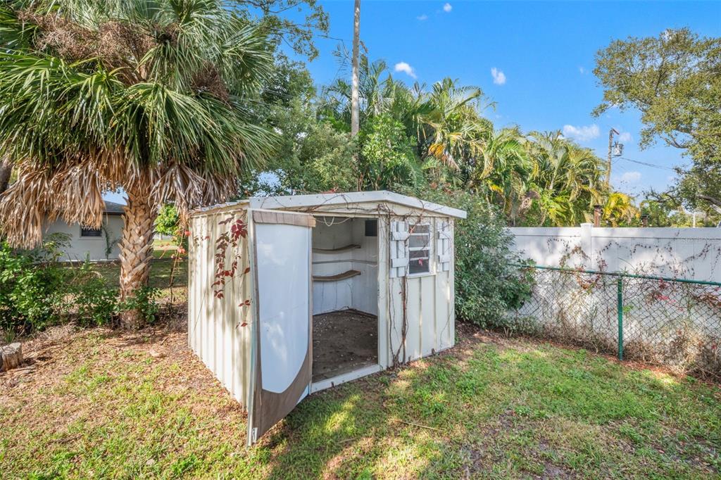 1472 Ruth Road Dunedin, FL 34698 - Photo 40 of 50 a view of a porch with a tree