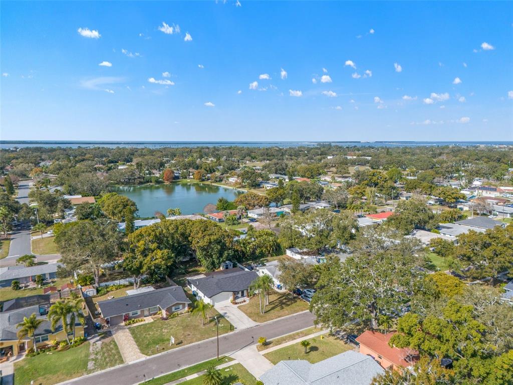 1472 Ruth Road Dunedin, FL 34698 - Photo 41 of 50 an aerial view of residential houses with outdoor space and swimming pool