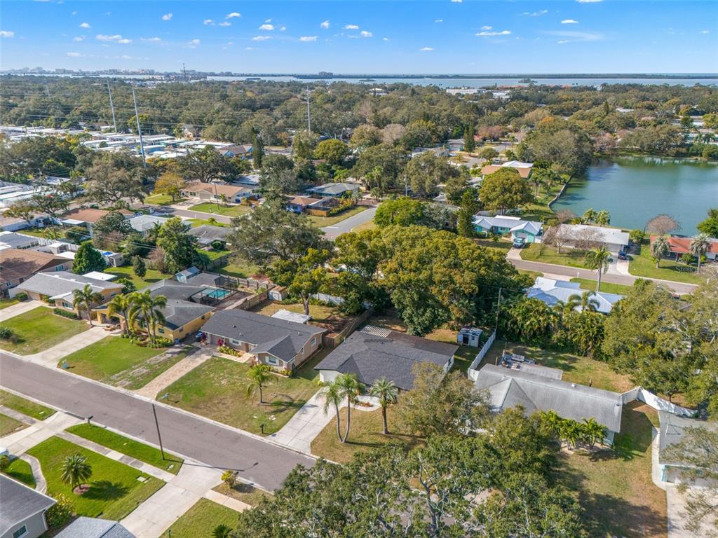 1472 Ruth Road Dunedin, FL 34698 - Photo 42 of 50 an aerial view of residential houses with outdoor space and river