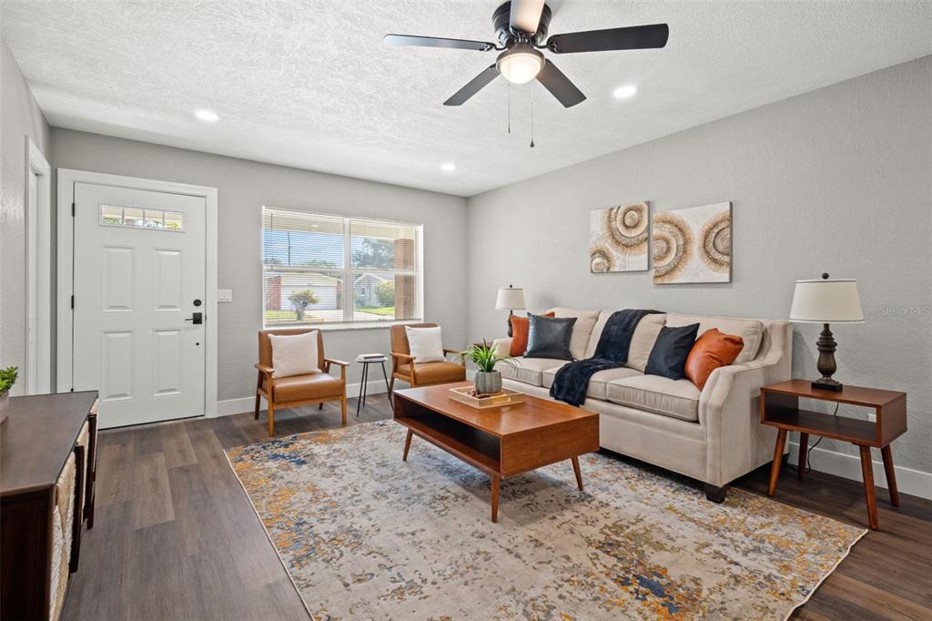 1472 Ruth Road Dunedin, FL 34698 - Photo 6 of 50 a living room with furniture and wooden floor