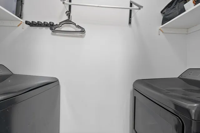 a kitchen with cabinets a refrigerator and a stove