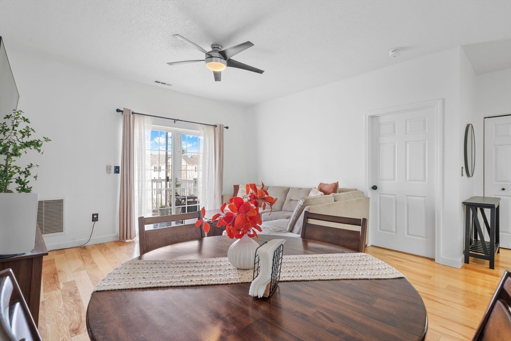 21 Hampshire Road, Unit 412 Methuen, MA 01844 - Photo 16 of 37 a bedroom with a bed and wooden floor