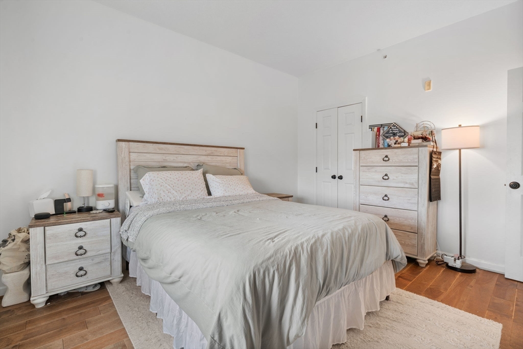 21 Hampshire Road, Unit 412 Methuen, MA 01844 - Photo 24 of 37 a bedroom with a bed and a tv