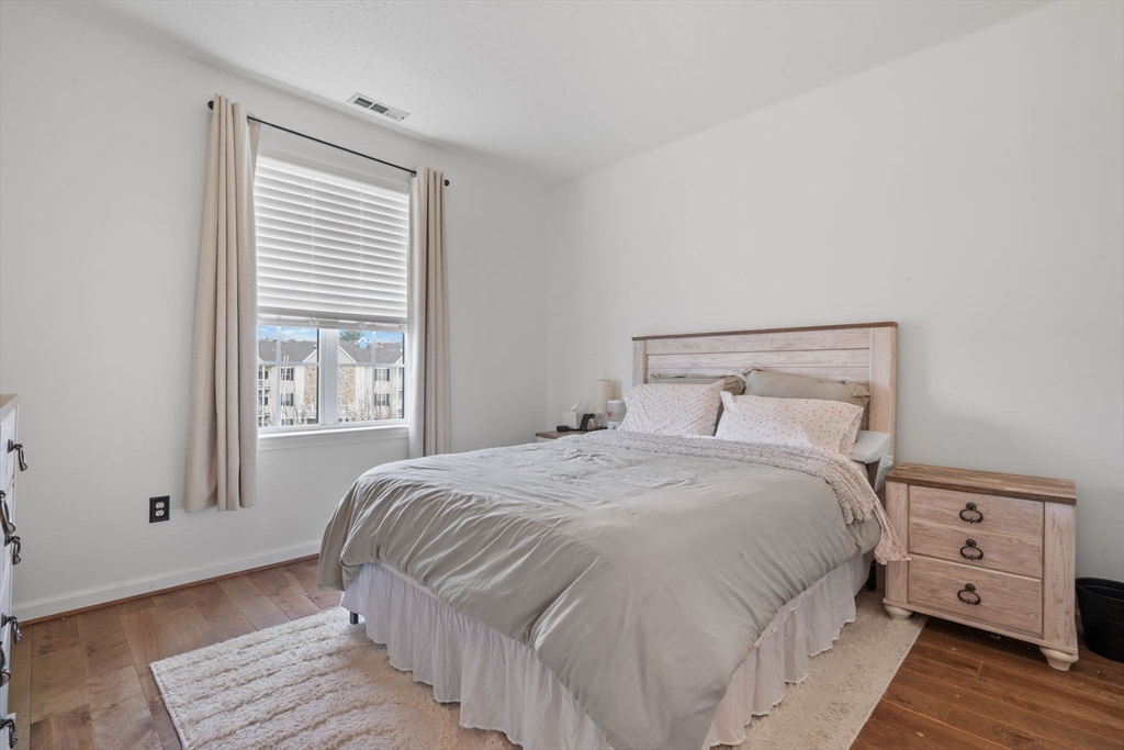 21 Hampshire Road, Unit 412 Methuen, MA 01844 - Photo 26 of 37 a bedroom with a bed and a window